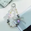 Nuevo accesorio de cadena para teléfono con lazo de cuentas de cristal de celebridad de internet, sección corta, colgante para teléfono, colgante anti-pérdida para teléfono, colgante para bolso