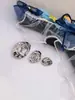 Botones Metálicos de Alto Gama Exquisitos para Abrigos, Estilo Europeo y Americano, Círculo Minimalista de Metal con Textura Cóncava y Convexa, Hueco Irregular Ovalado, Nicho