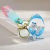 Llavero colgante de botella de arena movediza de red roja creativa, muñeco de perro Yugui flotante, adornos para bolso, accesorios acrílicos