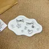 2025 Novo Cinza Prateado Urso Coelho Rosto Sorridente Laço Coração Versátil Outono e Inverno Novos Tamancos Sapato Interno Fivela de Sapato