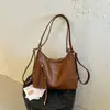 Bolsa Tote de Moda para Viajes de Otoño 2026 Mochila Retro de Gran Capacidad Bolso de Hombro Cruzado Simple de Color Sólido