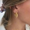 Aretes de Moda Europea y Americana Simples de Venta Caliente con Viento Frío Hueco Torcido para la Oreja Temperamento Personalidad Alto Sentido Joyería
