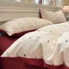 Nuevo juego de cuatro piezas jacquard teñido en hilo de alto peso, estilo simple y fresco, ropa de cama estilo princesa de lujo ligero