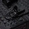 Suministro directo de fábrica salón de belleza aleación de aluminio negro estuche de cosméticos portátil doble apertura estuche de cosméticos Venta al por mayor