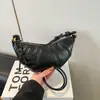 Bolso croissant vintage de nicho 2026 verano nuevo estilo ins para el trabajo bolso de hombro para teléfono bolso cruzado bolso de albóndiga moderno