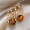 Nuevos Pendientes de Ojo de Tigre Maillard 2025 para Mujer Estilo Hong Kong Moda Retro Elegantes Pendientes Colgantes Traseros Pendientes