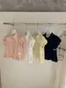 Wgwe9133 Guangzhou Shisanxing Moda Feminina Verão 2026 Novo Top Camisa Gola Polo Estilo Francês Manga Curta Solta