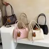 Bolso de mano simple de alta costura estilo coreano, bolso tipo cubo de nicho para el día a día, nuevo modelo 2026, bolso de hombro y axila elegante y versátil