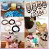 Venta de liquidación de gomas para el pelo, accesorios para el pelo y pinzas para el pelo; ofertas al por mayor de Yiwu