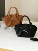 Bolso de hombro moderno y sencillo, nuevo bolso de mano para el verano de 2026, bolso tipo cubo informal de tendencia estilo coreano para mujer