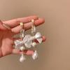 Pendientes de borla de perla con lazo de plata, estilo retro francés de alta gama, ligeros y distintivos, de lujo, a la moda para mujer.