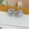 Pendientes de flor de circonita giratorios de estilo genial para mujer Pendientes de diseño de nicho de alta calidad de lujo ligero pendientes pendientes