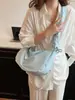 Bolso de mano de diseño nicho transfronterizo 2026 nuevo primavera-verano versión coreana de gran capacidad bandolera para estudiantes