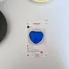 Funda para teléfono de cristal de color puro con forma de corazón simple, soporte con airbag, gema estéreo, soporte magnético telescópico Magsafe