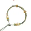 Pulsera de hebilla de paz cuerda trenzada producto semiacabado hecho a mano se puede usar como flor de solapa cuentas de transferencia doradas año zodiacal pulsera de cuerda roja para mujer