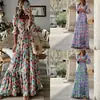 Sitio web independiente transfronterizo europeo y americano comercio exterior ropa de mujer primavera nuevo elegante cuello en V estampado bohemio vestido de campana