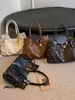 Bolso grande de moda retro para mujer 2026 nuevo bolso casual simple para el antebrazo bolso tote de hombro texturizado para el trabajo