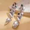 Pendientes grandes redondos de moda estilo europeo y americano, empalmados, con líneas geométricas exageradas y forma de corazón, perfectos para sesiones de fotos