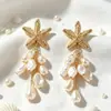 Pendientes de Borla Metálica de Estilo Fresco y Personalidad de Venta Caliente Transfronteriza Pendientes de Botón Versátiles de Moda con Forma de Concha, Estrella de Mar y Perla Sintética Adornos para Orejas