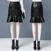 Nuevo falda de cola de pez de otoño para mujer, falda irregular de cintura alta para ir al trabajo con un corte elegante, falda ajustada con dobladillo de volantes, falda midi