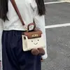 Otoño 2026 Nuevo Mini Bolso Kelly Estilo Padre-Hijo para Niños Bolso de Mano Cruzado Bolso de Mano de Dibujos Animados Texturizado Bolso de Hombro
