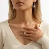 Pendientes de aro con forma de corazón de diamantes de imitación creativos, superventas transfronterizos europeos y americanos, conjunto de joyería elegante y favorecedor