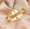 Pulsera de titanio de acero de oro rosa de 18k de venta caliente en línea, pulsera de moda para pareja hueca con incrustaciones de diamantes de oso para mujer, joyería al por mayor