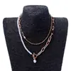 Europa y Estados Unidos collar apilado de cadena larga redonda con perlas de punto cruz vintage con hebilla OT para mujer