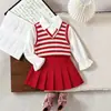 Outono 2026 Fornecimento Exclusivo Transfronteiriço Conjunto de Blusa de Tricô Listrada Patchwork + Saia Plissada Linha A para Bebês e Crianças Pequenas Conjunto de Duas Peças para Meninas