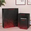 Bolso de mano blanco de alta gama con bronceado negro al por mayor en stock bolsa de papel para embalaje de regalo bolsa de regalo creativa bolsa de regalo para llevar