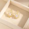 Pendientes de Pluma con Gota de Agua de Circonita de Cobre Pendiente Hueco Retro de Lujo Ligero con Diamantes Completos Pendiente de Temperamento para Dama de Banquete Europeo y Americano Fábrica de Pendientes