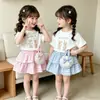 Conjunto de dos piezas de verano para niñas, ropa infantil de estilo nuevo con camiseta holgada de manga corta y falda de pastel, versión coreana de moda