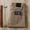 Estación europea 2022 otoño e invierno pantalones rectos gruesos con bolsillos sarga de algodón importado de negocios rectos vaqueros casuales para hombre
