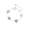 Desvanecimiento lento del colorPulsera de trébol de cuatro hojas de la suerte estilo coreano, modelo nuevo con intrincada artesanía de tallado, diseño de nicho, lujo ligero, alta gama, versátil