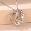 Collar de corazón de rosa bicolor europeo y americano transfronterizo con grabado en inglés, colgante de corazón de circón de amor romántico para mujer