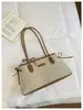 Bolso de mujer transfronterizo 2026 modelo nuevo, bolso de hombro simple para debajo del brazo, bolso baguette de gran capacidad para el día a día, bolso de mano tipo tote con retazos texturizados