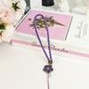 Cordão de celular camélia e capim da sorte criativo atacado corrente de celular flor de trevo de quatro folhas corda de celular PU trançada pingente
