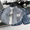 Conjunto de Verano para Niños 2026 Estilo Nuevo Camisa a Cuadros de Manga Corta para Niños Conjunto de Tres Piezas Ropa Moderna para Niños Bebés