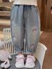 Nuevos Jeans de Dibujos Animados Otoño 2026 Estilo Coreano Modernos Pantalones de Campus para Niños y Niñas, Moda Infantil al por Mayor