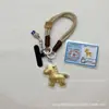 Chaveiro Popular de Ouro Puro 999 com Símbolo de Boa Sorte, Decoração para Capa de Celular, Presente para Amigos, Presente Empresarial, Atacado