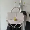 Versión coreana 2026 nueva moda alta calidad elegante versátil simple retro bolso de hombro cruzado bolso tipo silla de montar