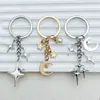 Llavero Popular de Cuatro Puntas Cruz Estrella Luna Transfronterizo Moda Colgante Decoración Simple para Bolso Amazon