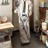 Pantalones casuales de traje a rayas con botones para hombre y mujer, nuevos de otoño vintage versátiles holgados que estilizan con caída y pierna ancha
