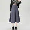 Foto real de saia longa de outono para mulheres, saia midi elegante e fluida, design irregular, adequada para o trabalho, saia longa evasê que cobre o quadril