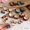 Pendientes de aro redondos con lunares y efecto de goteo de aceite estilo coreano ins, pendientes retro de alta gama de moda con un diseño único para mujer