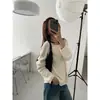 Novo Suéter de Malha Elegante Casual Coreano Dongdaemun Outono 2026 com Recortes Longo e Ombro a Ombro