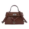 Yaozi 2026 outono inicial nova moda bolsa feminina de ombro único com textura de pedra, bolsa transversal versátil e estilosa