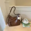 Bolsa Tote Retrô Melanoid Feminina Grande Capacidade 2026 Nova Outono Textura de Alta Qualidade Ombro Único Transversal Bolsa para o Dia a Dia