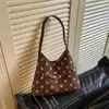 Bolso de lunares transfronterizo súper popular para mujer, nuevo estilo 2026, bolso de hombro versátil, bolso de axila, mochila casual, bolso para el día a día