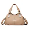 Bolsa de alta qualidade e elegante para mulheres, coleção outono/inverno 2026, com design simples, múltiplos compartimentos, e pode ser carregada na mão ou usada como bolsa de ombro ou bolsa transversal.
